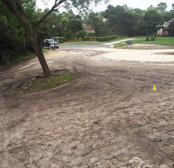 Before landscaping, cleared area