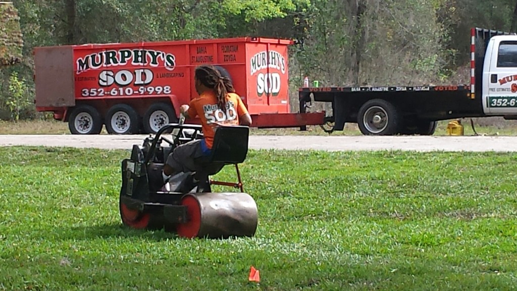 Murphy's Sod team using professional lawn roller